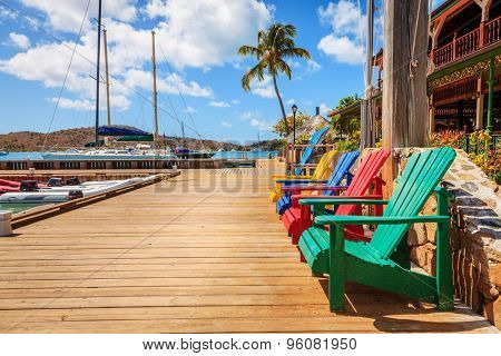 Adirondack chairs on a dock on Virgin Gorda Island, BVI