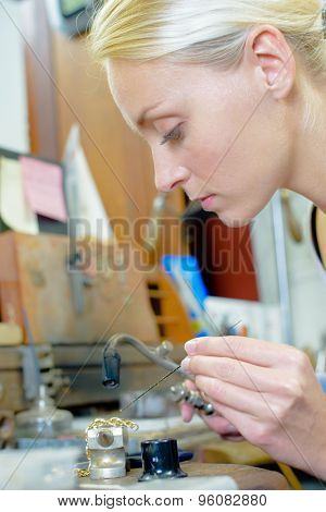 Jeweler repairing chain