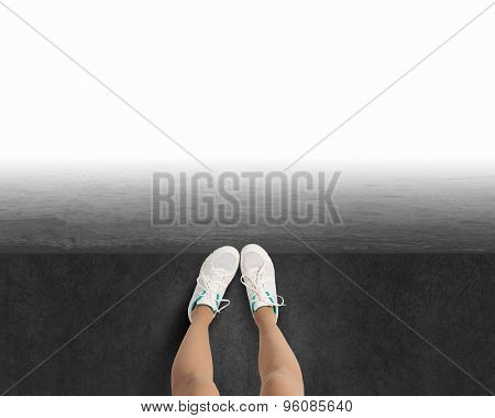 Woman standing on the edge of the roof