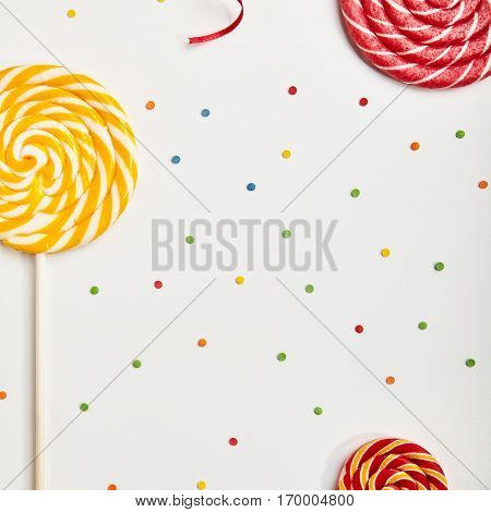 Birthday Concept - Holiday Top View Various Sweet Candy on White Background. Fun Brithday Decoration. Minimal Holiday and Food Concept. Flat Lay