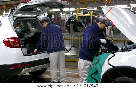 Tianjin, China. December 17Th 2016: Workers Assemble A Car On Assembly Line In Car Factory