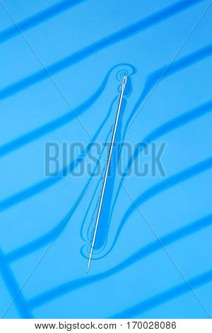 Physical experiment - needle floats on water surface.