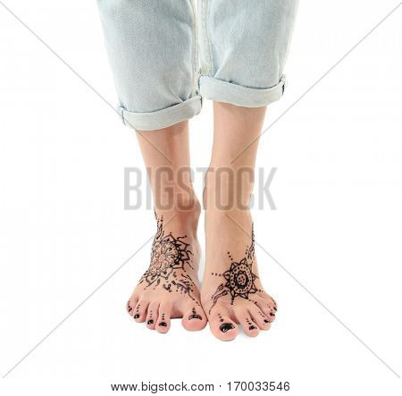 Female legs with henna tattoo, isolated on white