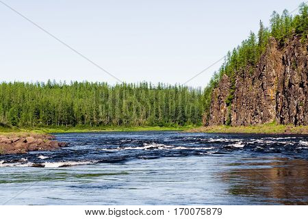 The rocky shore of a large river. Big river of Eastern Siberia. Krasnoyarsk region.