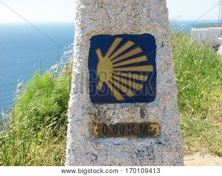 Sign with shell on the road towards santiago de compostela