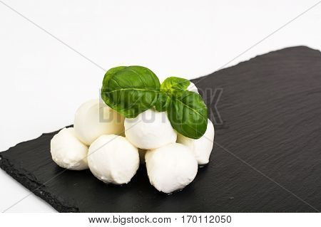 Mini mozzarella balls on white. Studio Photo