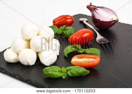 Mini mozzarella balls on white. Studio Photo
