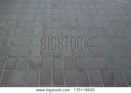 Tiled floor is area outside the house.