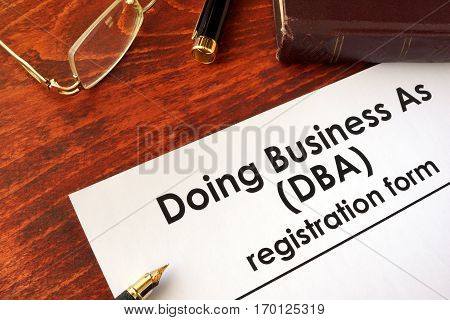 DBA Registration doing business as form on a table.