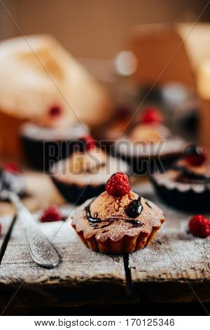 Delicious Chocolate Cupcakes With Berries On Wodeen Table, Top V