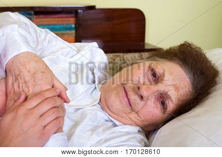 Picture of a bedridden elderly woman at home