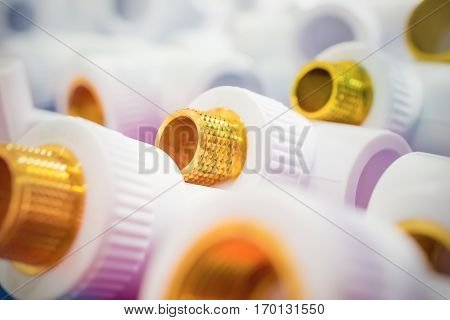 Plastic fittings for pipes. Bronze metallic threaded components.