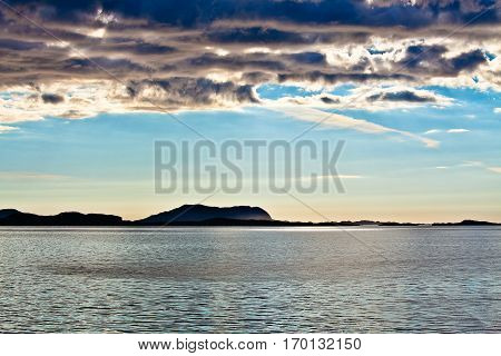 Summer Norwegian Landscape in the midnight sun with see and mountain