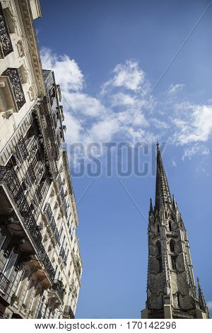 Saint Michel's bell tower and classical redidential building facade,  Bordeaux France