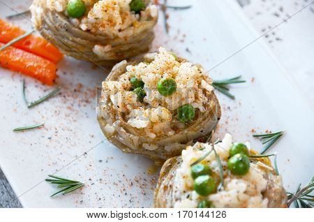 Cooked Artichokes with rice green peas carrot and olive oil. Turkish dish - Zeytinyağlı enginar. Selective focus.