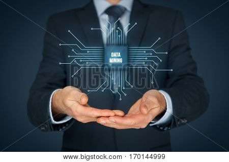 Data mining (data-minig) concept. Abstract symbol of a chip with text data mining connected with data represented by points.