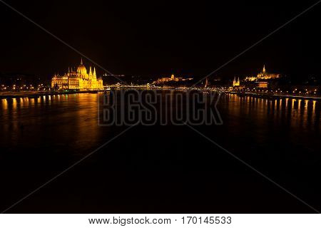 Hungarian National Parliament Building Located At The Bank Of The Dunabe River With Famous Chain Bri