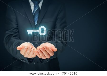 Businessman (consultant, coach, leader, customer service, CEO or another business person) offer key to success or solution. Turnkey solution and services concept. Left composition.