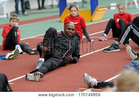 ZHUKOVSKY, MOSCOW REGION, RUSSIA - JUNE 27, 2014: IAAF World Champion Wilson Kipketer of Denmark gives a master class for young Russian athletes during the Znamensky Memorial
