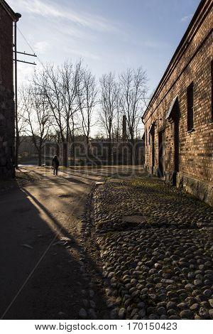 old street of Suomenlinna Island Fortress in the sunset light, Helsinki Finland
