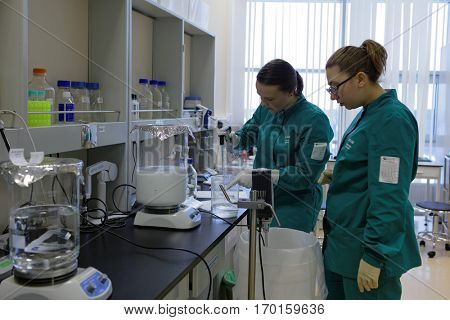 ST. PETERSBURG, RUSSIA - NOVEMBER 16, 2016: Researchers at work in the High-Throughput Biotechnology Laboratory of BIOCAD. It is one of full-cycle drug development and manufacturing companies