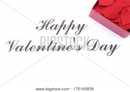 Valentine card with box red heart on wooden desk.