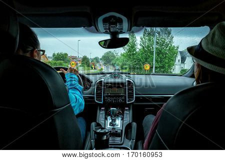 Women in car indoor keeps wheel and passenger on front seat idea taxi driver
