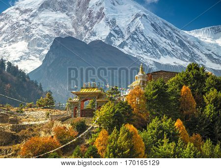 Himalayas mountain landscape. Buddhist monastery and Manaslu mount in Himalayas, Nepal. View from Manaslu circuit trek