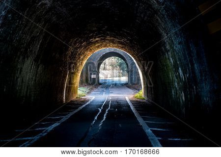 Dark UK Road Tunnel on Sunset in England.