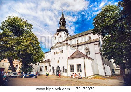 TALLINN ESTONIA - JULE 29 2013: Old town Tallinn with St. Nicholas church in summer morning