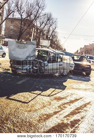 Auto accident involving two cars on a city street. Car crash. Vertical image