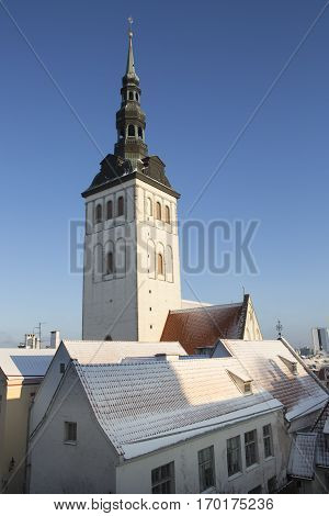 St. Nicholas' Church with snowy roofs in front, Tallinn Estonia