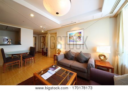 SEOUL - NOV 2, 2015: Room with sofa, tables and exit door in hotel Fraser Insadong