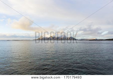 View of a Norwegian fjord with snowy mountains Nordland Norway