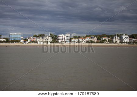 View of the coastline with seaside resort of Royan with grey tourmented sky France