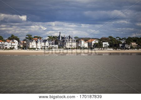 View of the coastline with seaside resort of Royan with grey tourmented sky France
