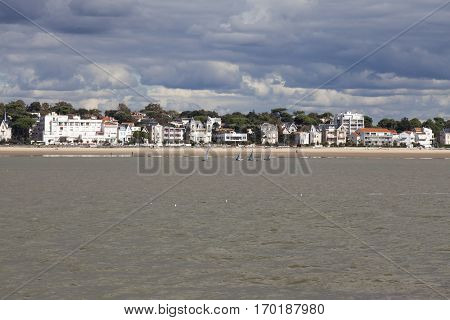 View of the coastline with seaside resort of Royan with grey tourmented sky France