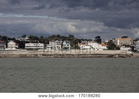View of the coastline with seaside resort of Royan with grey tourmented sky France