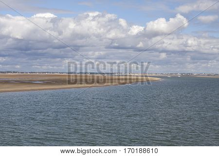 maritime seaside landscape with water sand bank and white cloud garonne estuary near Royan France