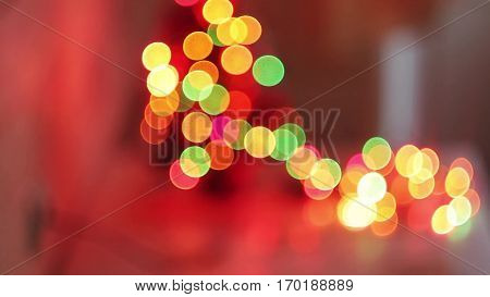 Christmas and New Year Decoration. Abstract Blurred Bokeh Holiday Background. Blinking Garland. Christmas Tree Lights Twinkling.