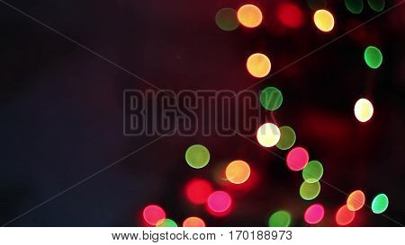 Christmas and New Year Decoration. Abstract Blurred Bokeh Holiday Background. Blinking Garland. Christmas Tree Lights Twinkling.