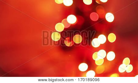 Christmas and New Year Decoration. Abstract Blurred Bokeh Holiday Background. Blinking Garland. Christmas Tree Lights Twinkling.