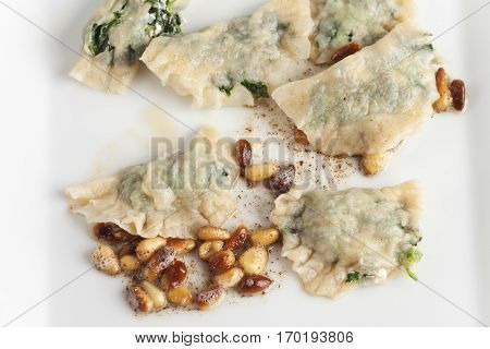 closeup of some italian schlutzkrapfen filled pasta