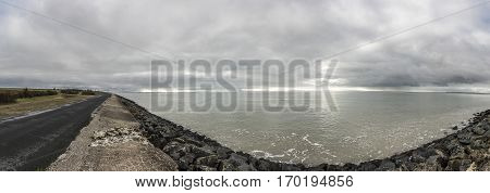 Panoramic view of the dyke proctecting the village of l'Aiguillon sur Mer Vendee France