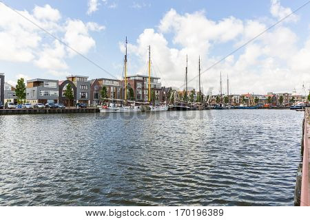 Noorderhaven canal with boats and houses in historic old town of Harlingen Friesland Netherlands