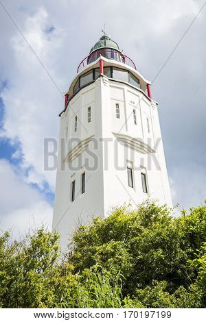 old white lighthouse in Harlingen Friesland the Netherlands