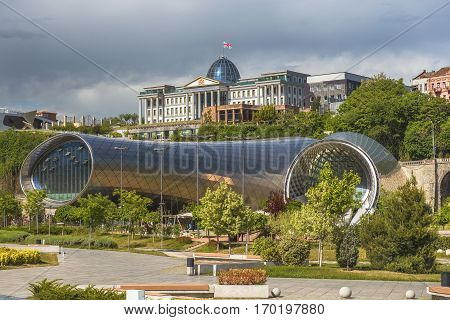 Tbilisi, Georgia - May 5, 2016: two sculptural volumes for a New Cultural Center (foreground) and the Presidential Palace (background) in Tbilisi, Georgia on May 5, 2016