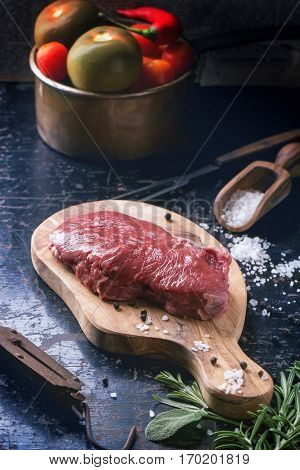 Raw Steak With Herbs And Pepper