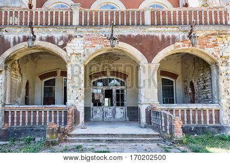 Taul Park, old ruined entrance main red building, north of Moldova
