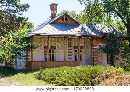 Taul Park, old ruined entrance main red building, north of Moldova